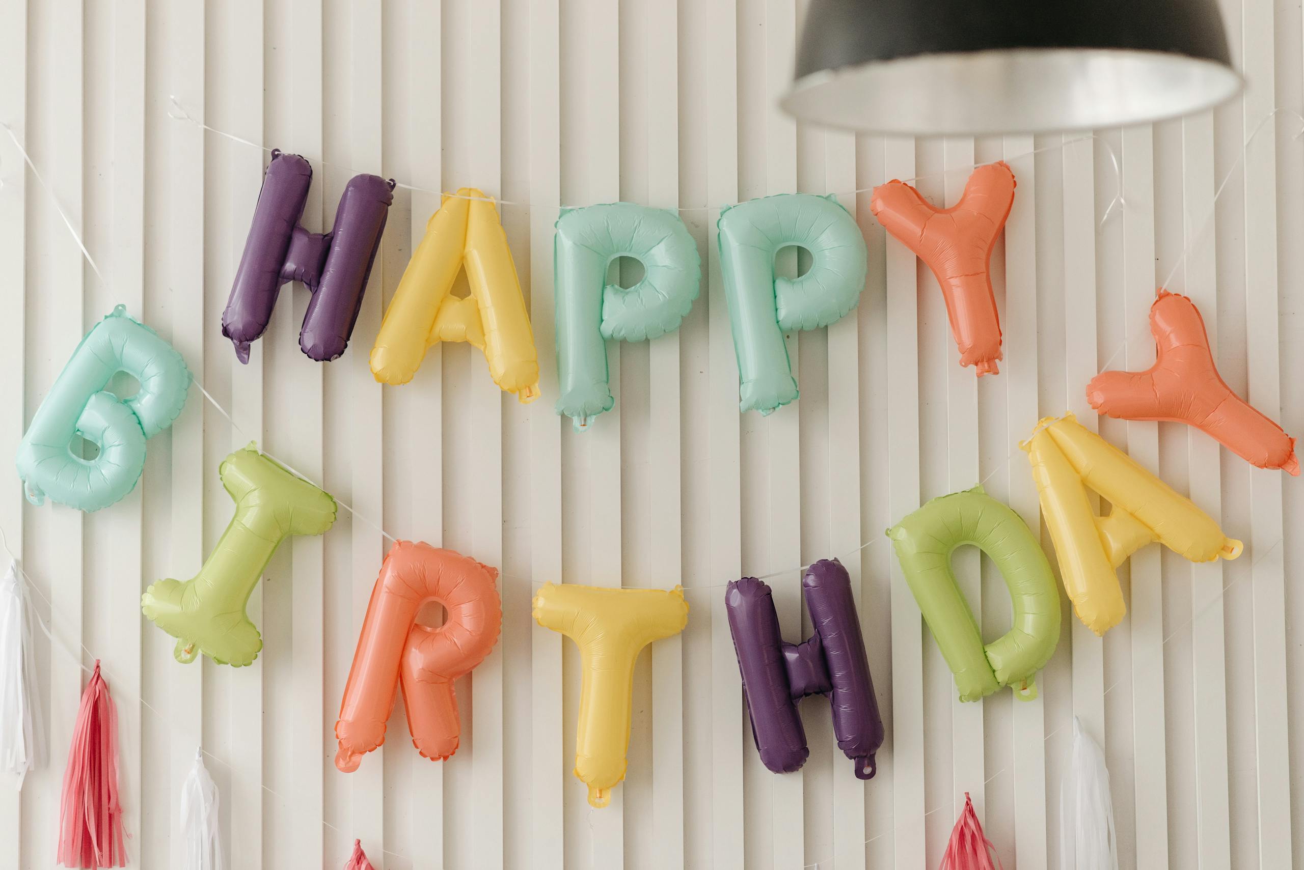 Vibrant balloons spelling 'Happy Birthday' add joy to any party setting.